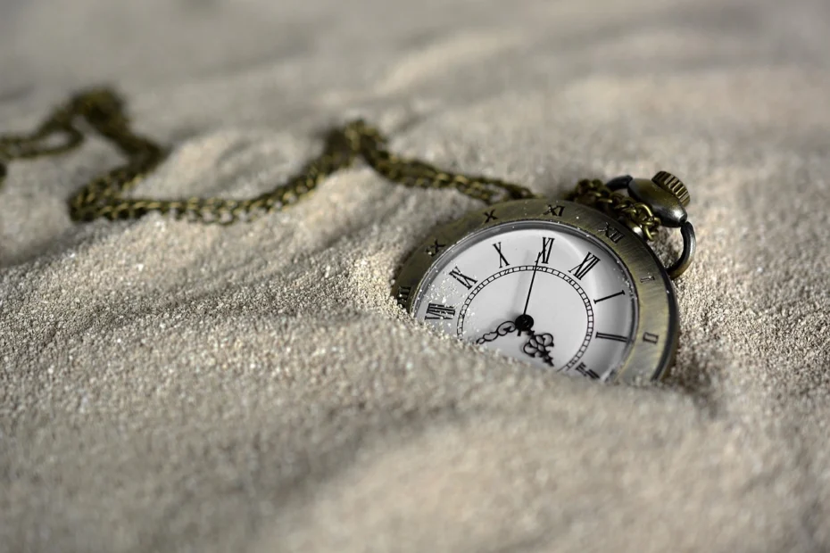 A watch in the sand, representing the sands of time... time in business.